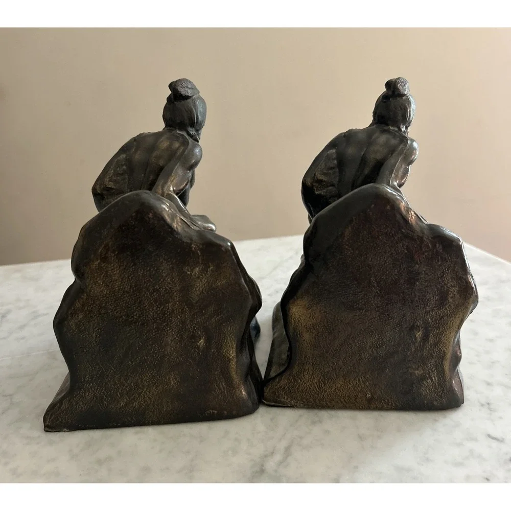 Antique Meal metal cast Indian bookends. Good condition.